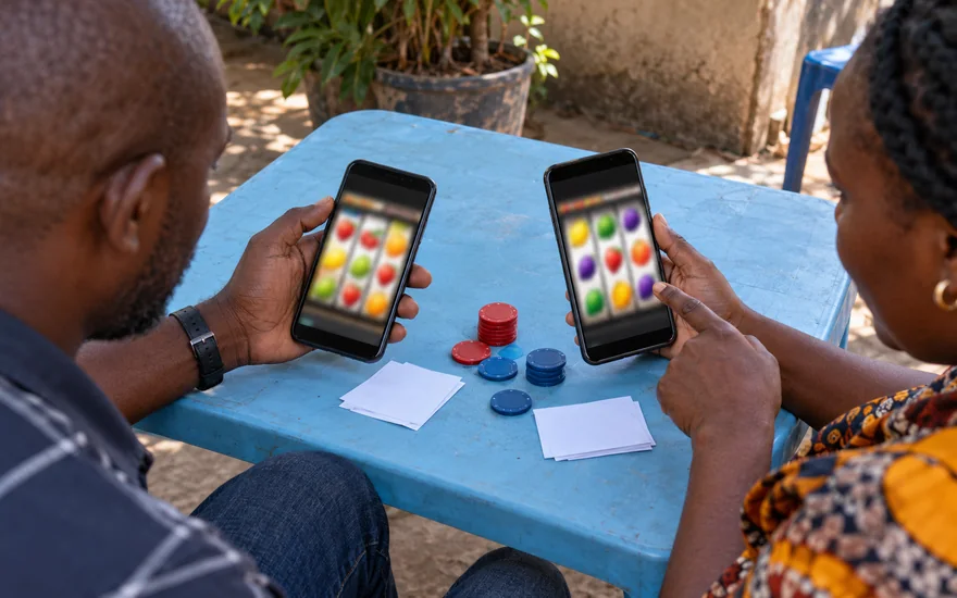 Best online casino Zambia illustrated with two casino phones compared with coupons and chips.